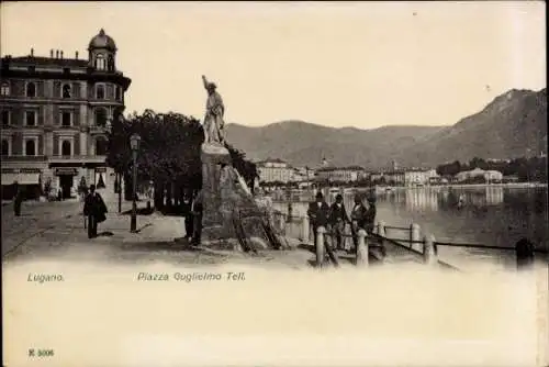 Ak Lugano Kanton Tessin Schweiz, Piazza Guglielmo Tell, Statue, Stadtansicht, Schweizer Alpen