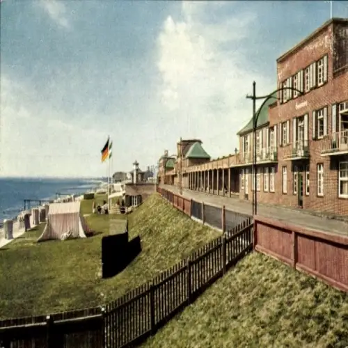 Ak Wilhelmshaven an der Nordsee, Blick auf Strandpromenade, Gebäude, deutsche Flagge, sonniger Hi