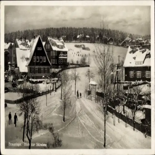Ak Braunlage im Oberharz, Schneelandschaft, Blick auf Skiwiese, Häuser, winterliche Atmosphäre