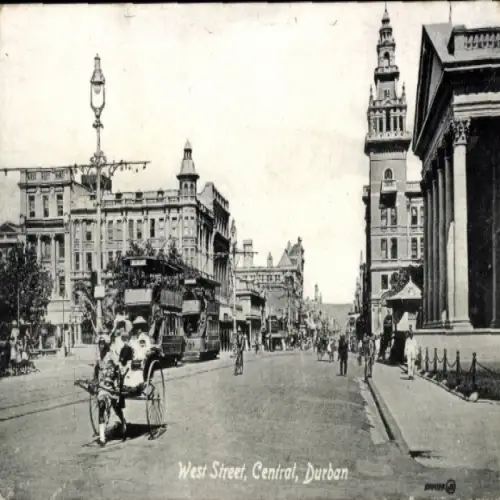 Ak Durban Südafrika, West Street, Central, Straßenansicht,  Tram, Gebäude