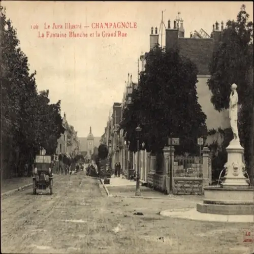 Ak Champagnole Jura, Straße mit Statue, Gebäude,  Atmosphäre, frühes Auto, Pflanzen