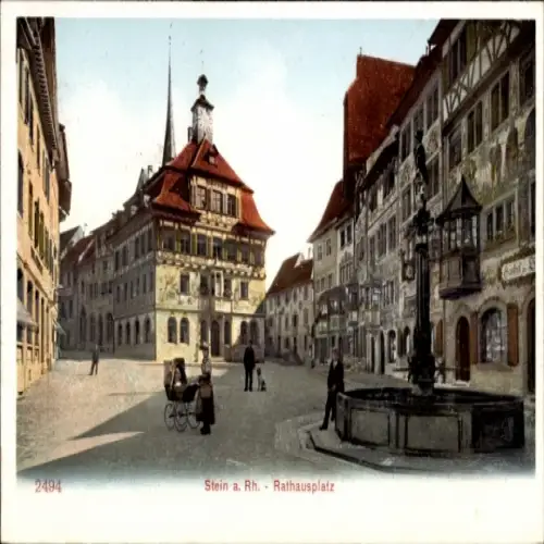 Ak Stein am Rhein Kanton Schaffhausen, Rathausplatz, Gebäude mit Turm, Brunnen, Menschen, Fahrrad