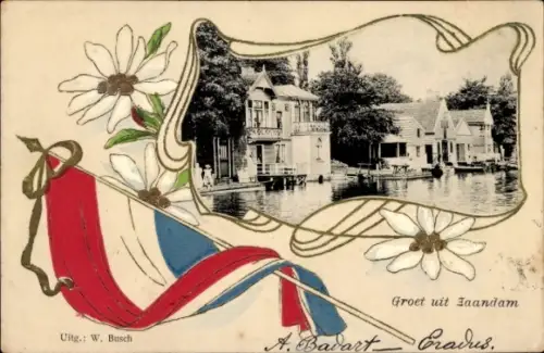 Präge Ak Zaandam Zaanstad Nordholland, Fluss, Häuser, Fahne, Blumen