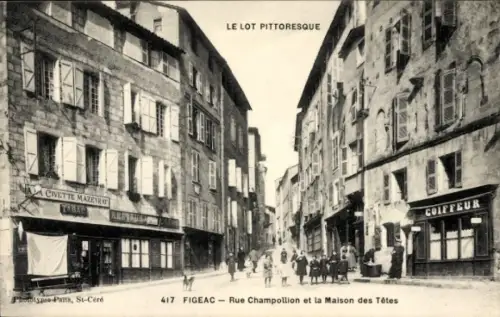 Ak Figeac Lot, Rue Champollion, Maison des Tetes