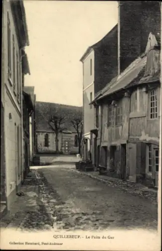 Ak Quillebeuf sur Seine Eure, Straße mit Häusern, Bäume im Hintergrund, Schwarz-Weiß-Foto