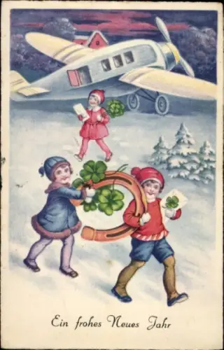 Ak Fröhliches Neujahr, Kinder mit Hufeisen und Kleeblättern, Flugzeug