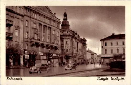 Ak Cluj Napoca Klausenburg Kolozsvar Rumänien,  Mátyás király-tér,  Gebäude, Autos
