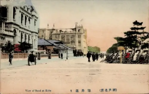Ak Kobe Honshu Hyogo Japan, Nanko Tempel, Ansicht des Bunds in  Menschen auf der Straße, Pferdeku
