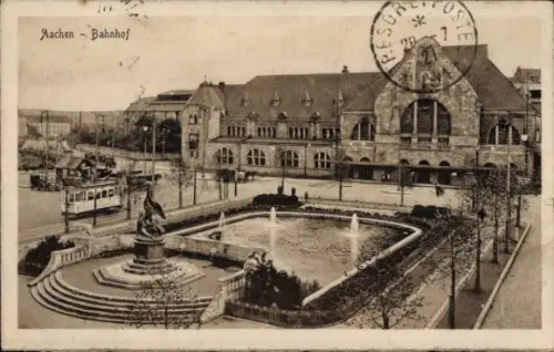Ak Aachen in Nordrhein Westfalen, Bahnhof, Vorplatz, Straßenbahn, Denkmal