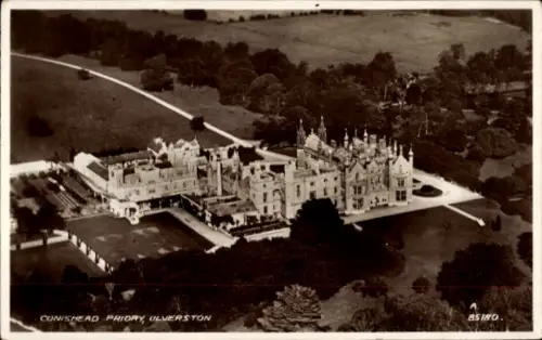 Ak Ulverston Cumbria England, Luftaufnahme von Conishead Priory,  große Gebäude, Gartenanlagen