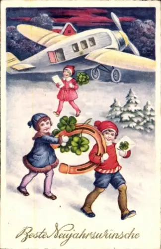 Ak Fröhliches Neujahr, Kinder mit Hufeisen und Kleeblättern, Flugzeug