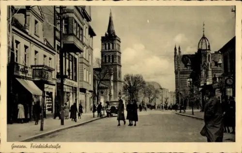 Ak Gniezno Gnesen Posen,  Friedrichstraße, Straßenansicht, Menschen, Gebäude