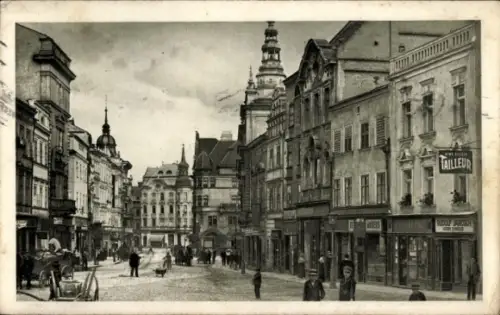 Ak Opava Troppau Region Mährisch Schlesien, Straße mit Geschäften, Menschen, Pferdewagen,  Gebäud