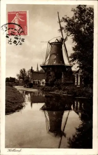 Ak Niederlande, Windmühle am Wasser
