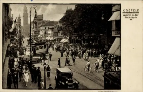 Ak Krefeld am Niederrhein, Verkehr in der Rheinstraße, Menschenmenge, Straßenbahn, Autos