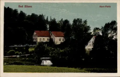 Ak Bad Eilsen Niedersachsen,  Harri-Partie, Gebäude mit roten Dächern, Bäume, Wasserfall