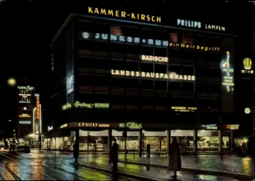 Ak Karlsruhe in Baden,  Kaiserstraße bei Nacht, Werbung für Geschäfte, Neonlichter