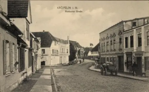 Ak Kröpelin in Mecklenburg, Rostocker Straße, Geschäfte, Pferdewagen