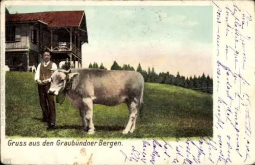 Ak Gruß aus den Graubündner Bergen, Mann mit Kuh