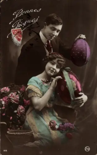 Ak Frohe Ostern, Paar mit Ostereiern, coloriert