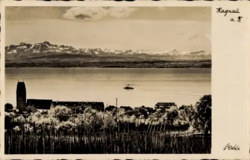 Ak Hagnau am Bodensee, Schwarzwasser, Boot auf dem Wasser, Berge im Hintergrund, Hagnau