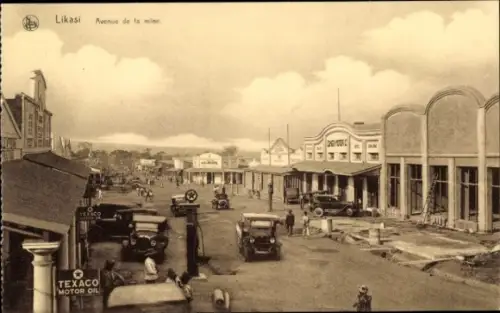Ak Jadotville Likasi DR Kongo Zaire, Avenue de la mine, historische Straße, alte Autos, Texaco...
