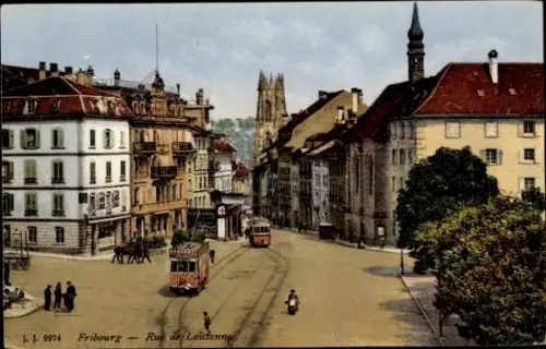 Ak Fribourg Freiburg Stadt Schweiz, Stadtansicht  Rue de Lausanne, Straßenbahn, Gebäude