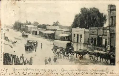 Ak Pretoria Südafrika, Straße in  Pferdefuhrwerke, Regen, Menschenmenge