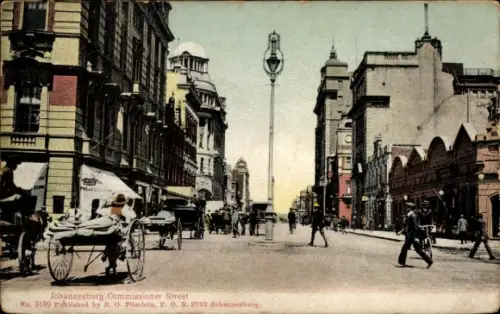 Ak Johannesburg Südafrika,  Commissioner Street, Straßenansicht, Pferdekutschen,  Gebäude
