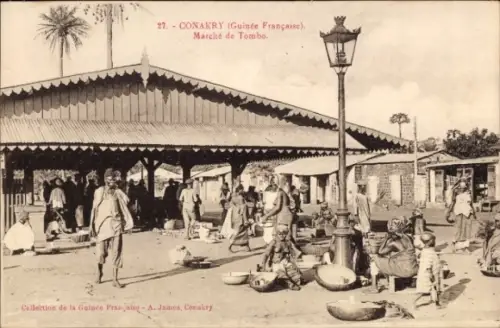 Ak Conakry Guinea, Markt in  Guinee, Menschen, Waren, Stände, Lampen
