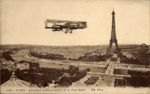 Ak Paris VII., Aeroplane evoluant autour de la Tour Eiffel