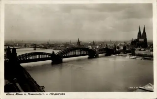 Ak Cöln Köln am Rhein,  Rhein, Hohenzollernbrücke, Hängebrücke, Stadtansicht