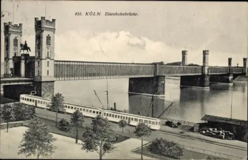 Ak Cöln Köln am Rhein, Eisenbahnbrücke,  Fluss, Straßenbahn, Bäume