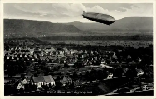Ak Weil am Rhein, Luftaufnahme von  Zeppelin, Häuser, Landschaft