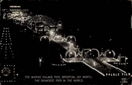Ak Brighton East Sussex England, Marine Palace Pier,  Nachtaufnahme, beleuchtet, grandios