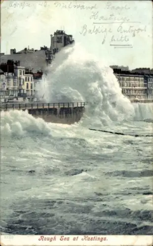 Ak Hastings East Sussex England, Wellen, Küste, Gebäude, Text auf Englisch, 