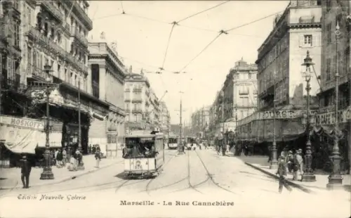 Ak Marseille Bouches du Rhône, Rue Cannebière, Straßenbahn, Geschäfte