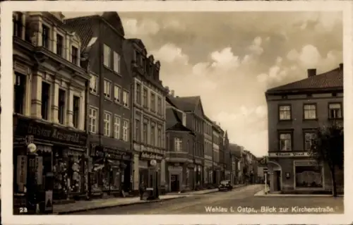 Ak Snamensk Wehlau Ostpreußen, Kirchenstraße, Shell Tankstelle, Geschäfte