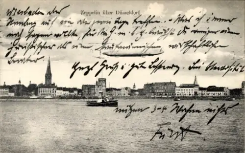 Ak Düsseldorf am Rhein, Zeppelin über der Stadt