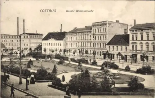 Ak Cottbus in der Niederlausitz,  Kaiser Wilhelmplatz, Stadtansicht, Menschen, Bäume, Brunnen