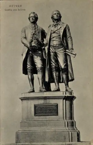 Ak Weimar in Thüringen, Statue von Goethe und Schiller,  Schriftzug 'Goethe und Schiller'