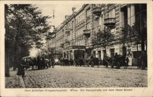 Ak Vilnius Wilna Litauen, Georgstraße mit Hotel Bristol, östlicher Kriegsschauplatz, Armeefuhrwerke