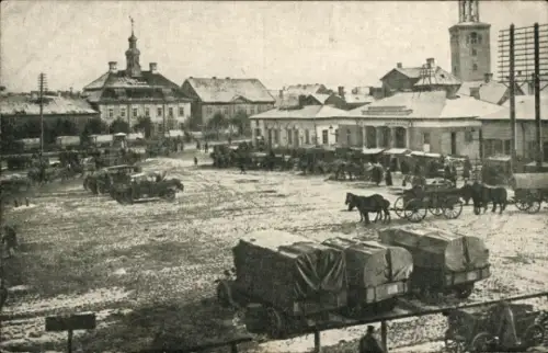 Ak Jelgava Mitau Lettland, Marktplatz mit Pferdefuhrwerken, Schnee, Gebäude, Kommandantur Mitau