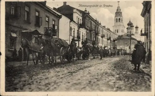 Ak Hrodna Grodno Weißrussland, Pferdewagen auf Straße, Häuserzeile, Kirchturm im Hintergrund