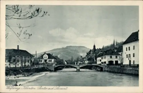 Ak Wolfsberg in Kärnten,  Fluss, Brücke, Häuser, Landschaft