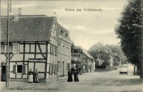 Ak Schlebusch Leverkusen im Rheinland, Gruss aus   Gebäude, Straßenansicht, Personen in Kleidung