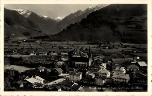 Ak Bruck an der Großglocknerstraße in Salzburg, Blick auf Bruck, Berge, Kirche, Häuser, Landschaf
