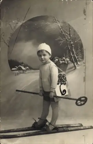 Ak Junge auf Skiern, Blumenkorb