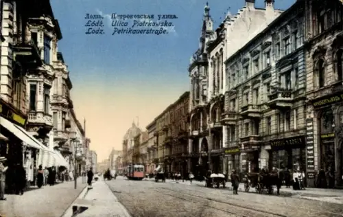 Ak Łódź Lodz Lodsch Polen, Straße mit Tram, Geschäfte, Menschen, mehrsprachiger Text