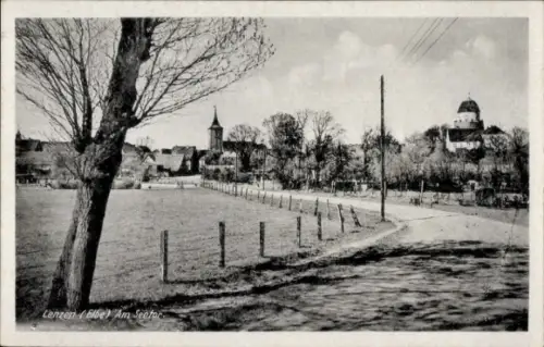 Ak Lenzen an der Elbe Prignitz,  Am Seetor, Landschaft mit Bäumen, Kirche, Gebäude